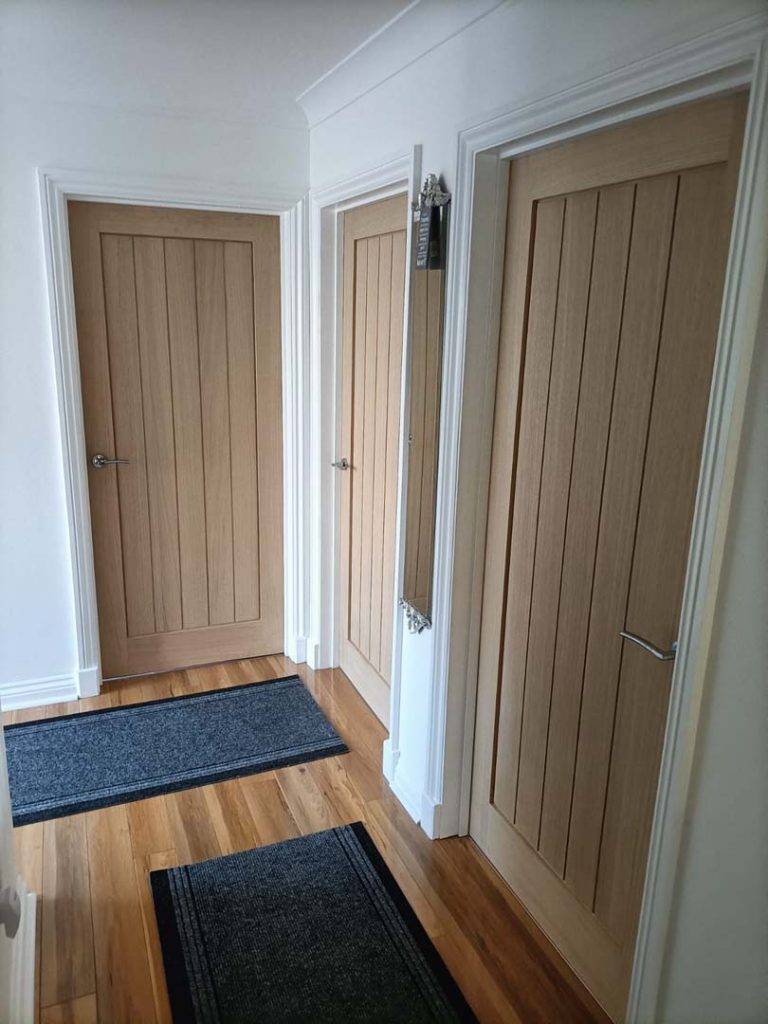 3 interior doors leading to bedrooms